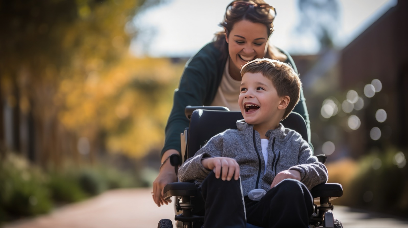Child in wheelchair with caregiver